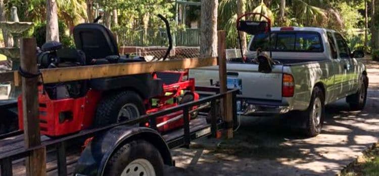 Equipment used by Leo Garden Care to service lawns on a trailer.